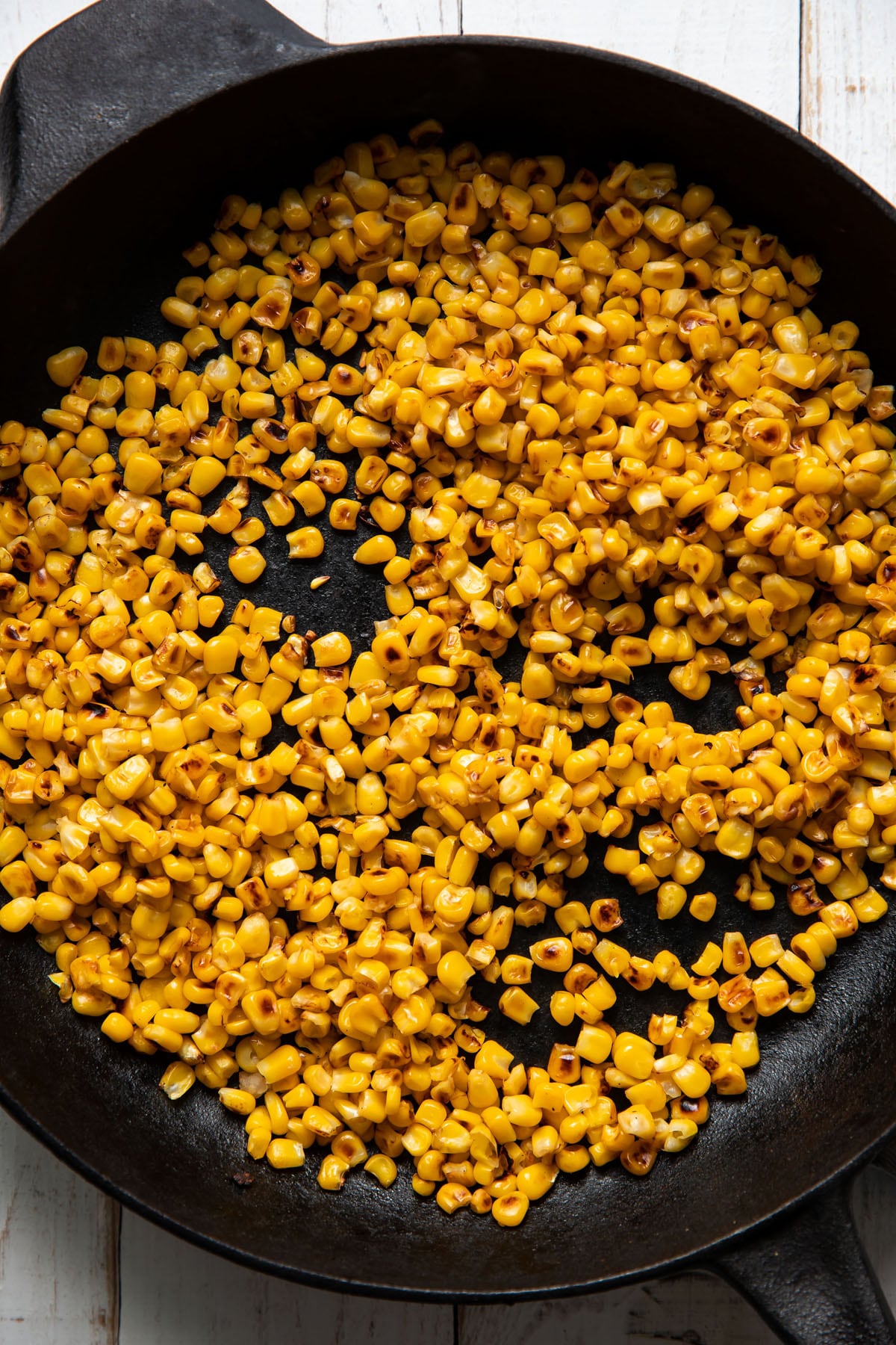 charred corn in a skillet