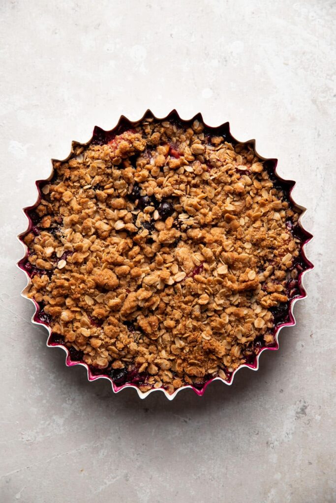 baking dish with blueberry peach crisp after baking