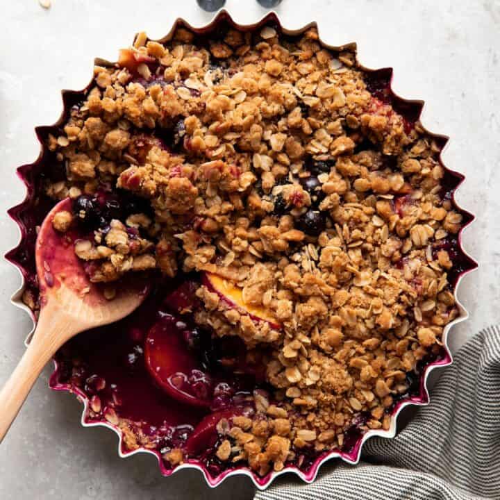 baking dish with blueberry peach crisp after baking