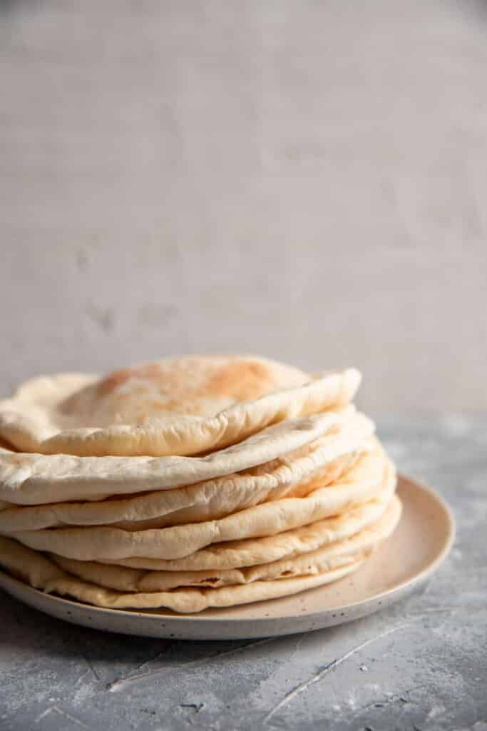 pitas stacked on a plate side view