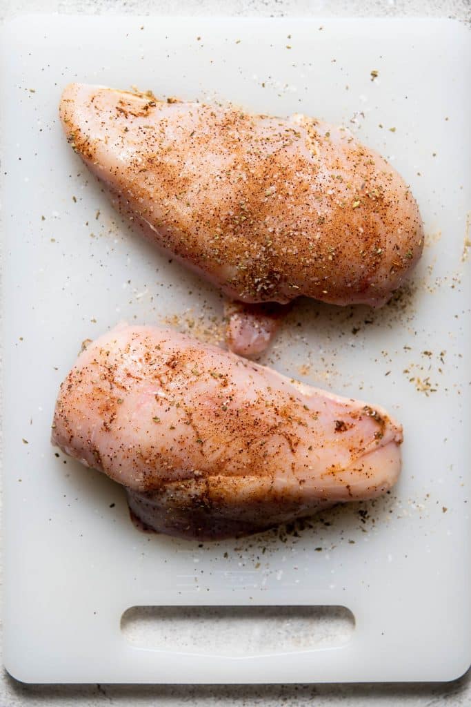 uncooked chicken on a cutting board