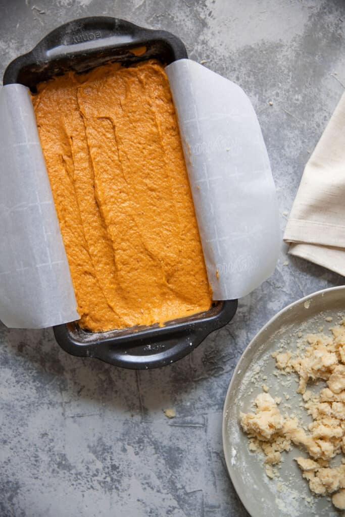 pumpkin batter in a loaf pan prior to baking