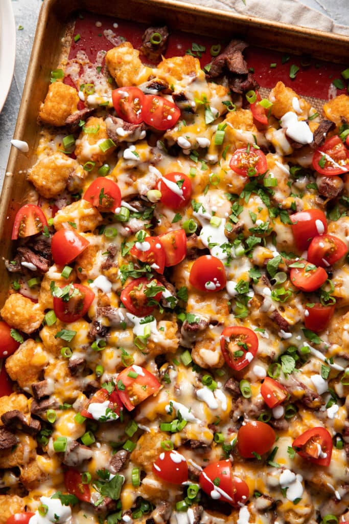 tater tot steak nachos southwest style on a sheet pan