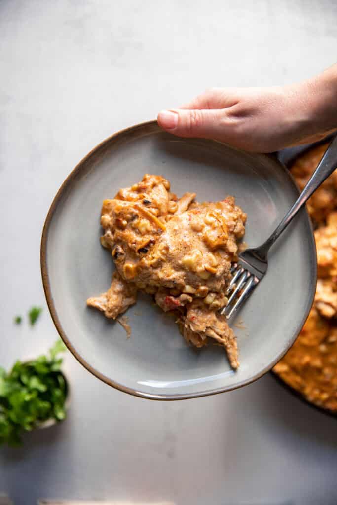 mexican street corn white chicken enchiladas on a plate