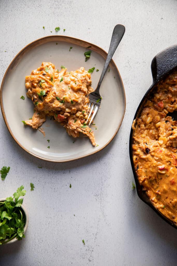 mexican street corn white chicken enchiladas on a plate