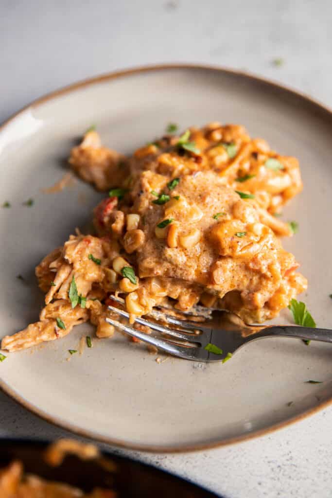 mexican street corn white chicken enchiladas on a plate