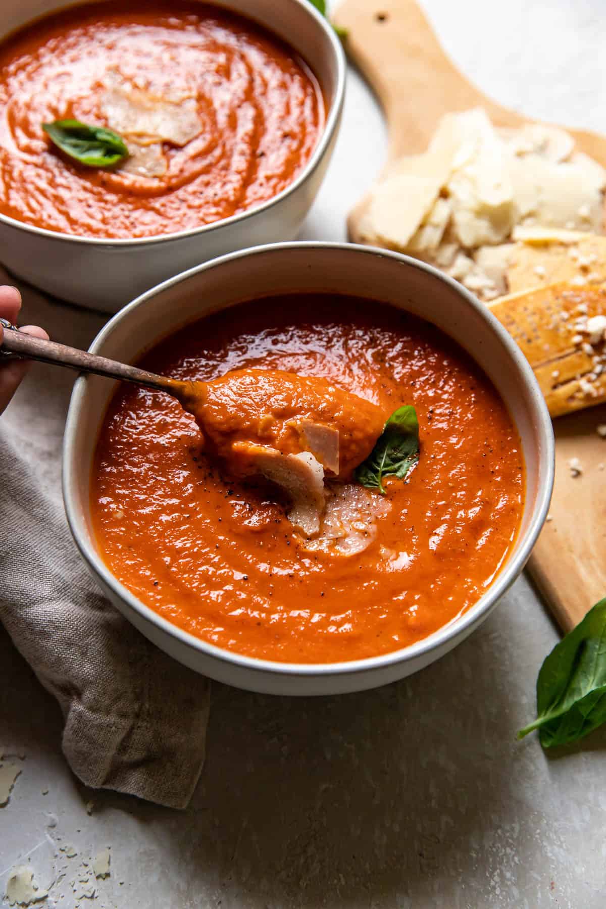 tomato basil soup in bowls.