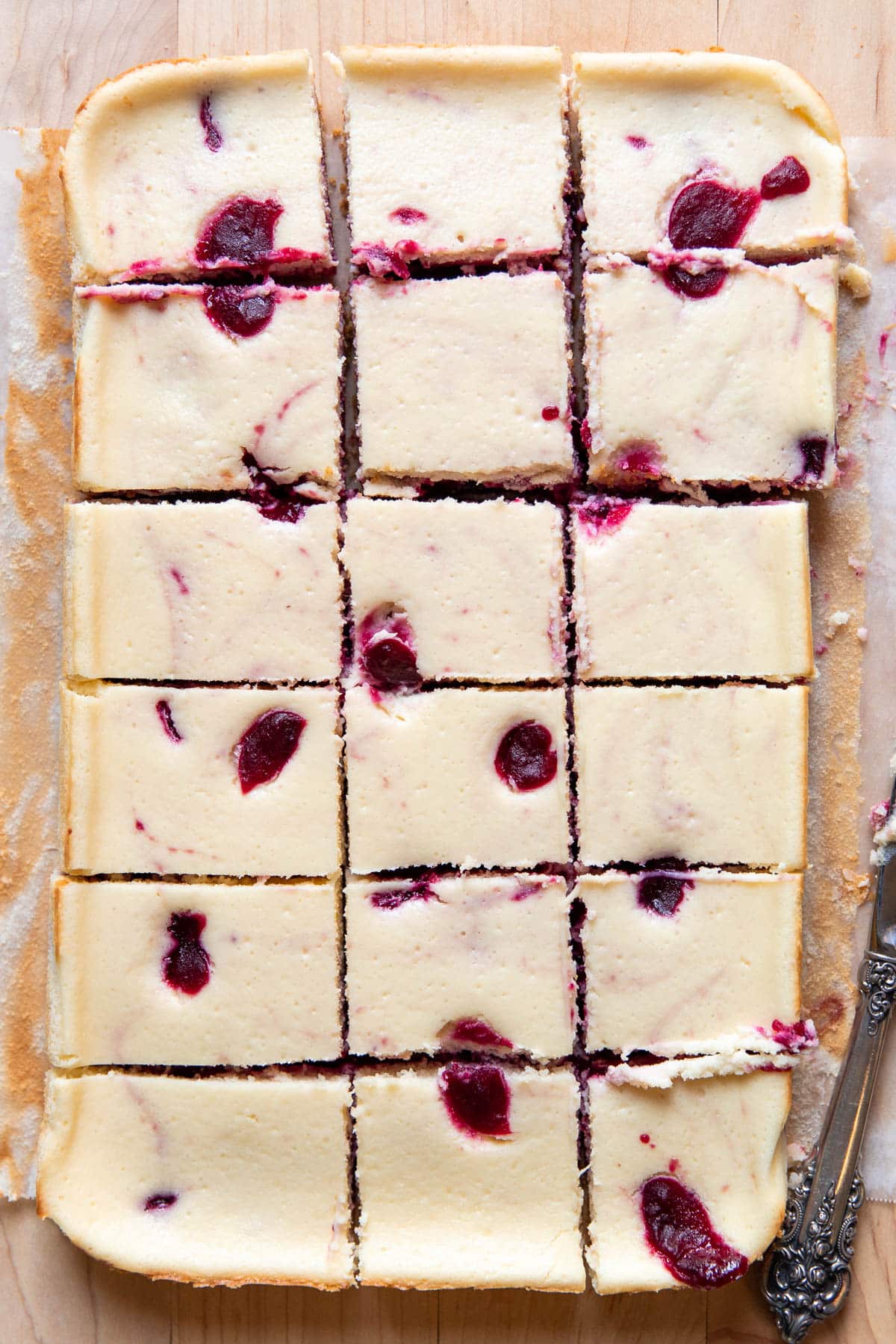 cranberry cheesecake cut into squares