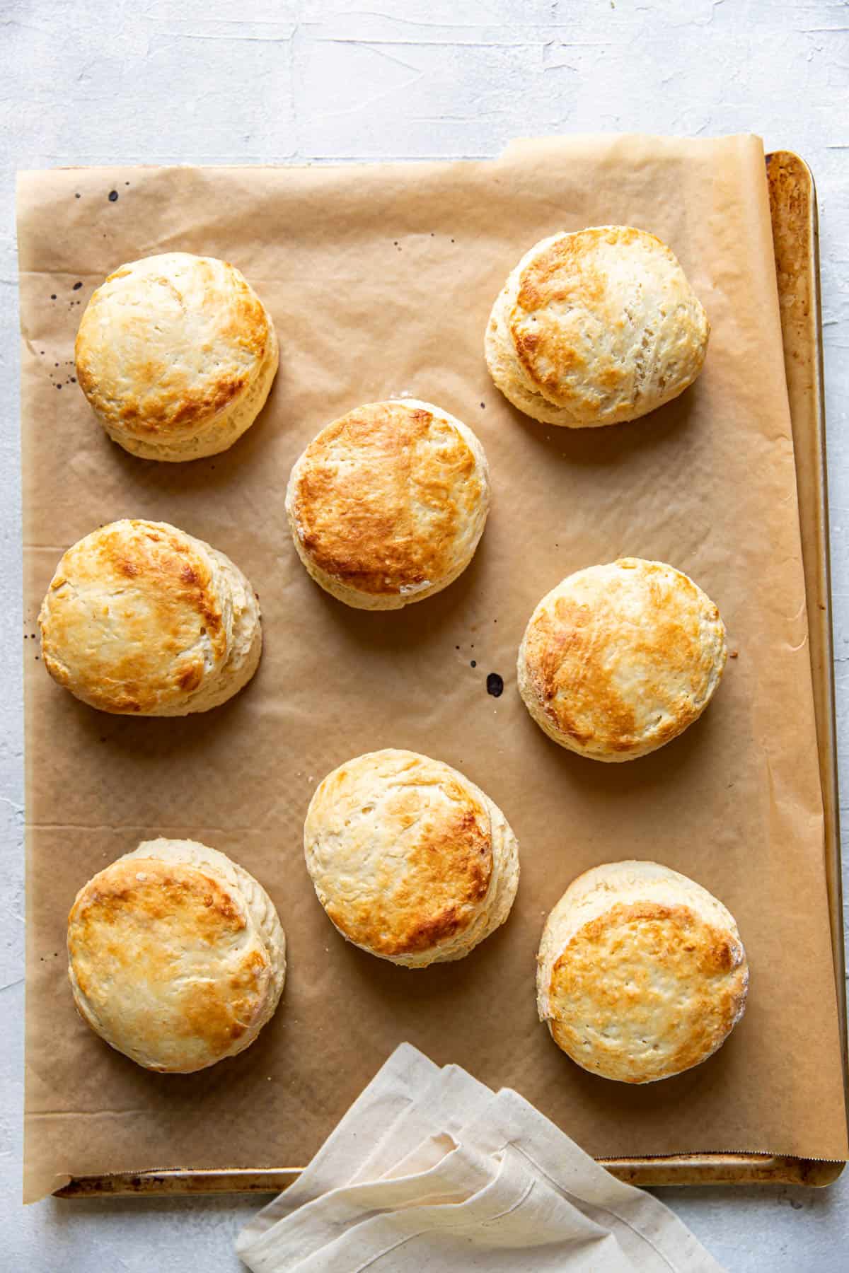 buttermilk biscuits on a baking sheet.