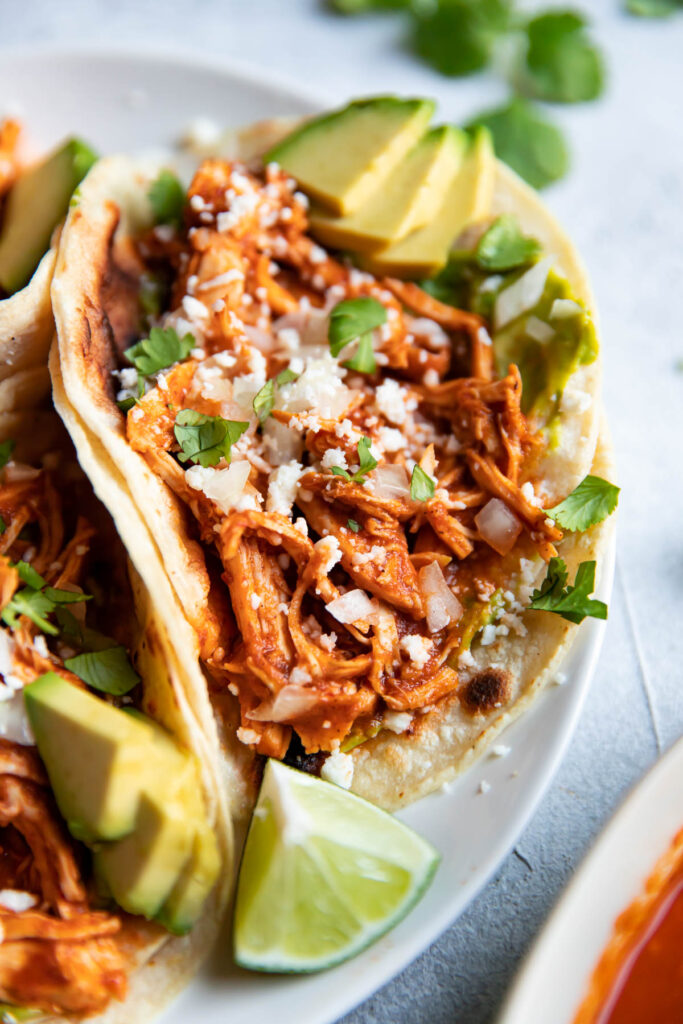 Chicken tinga taco on a plate.