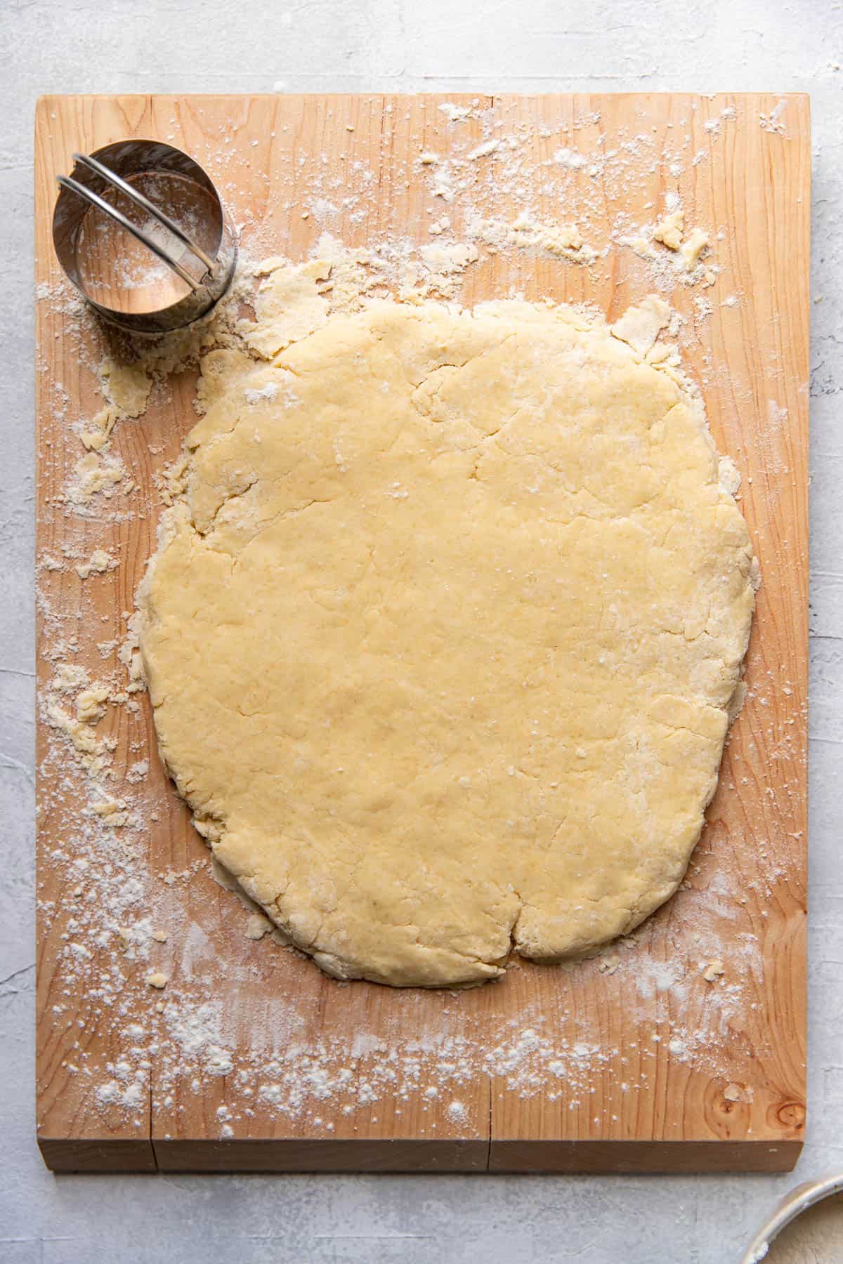 Irish scone dough on a cutting board.