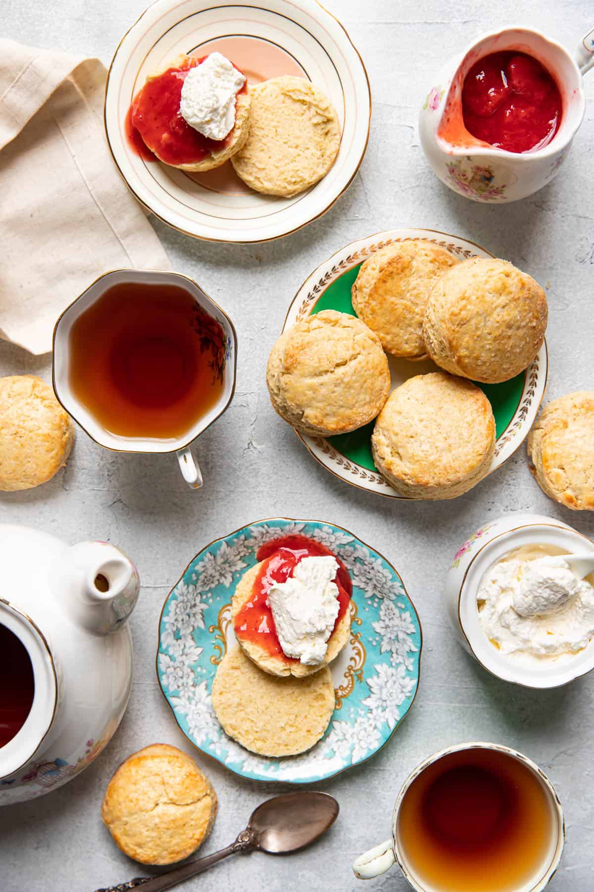 Irish scones with tea cups and jam.