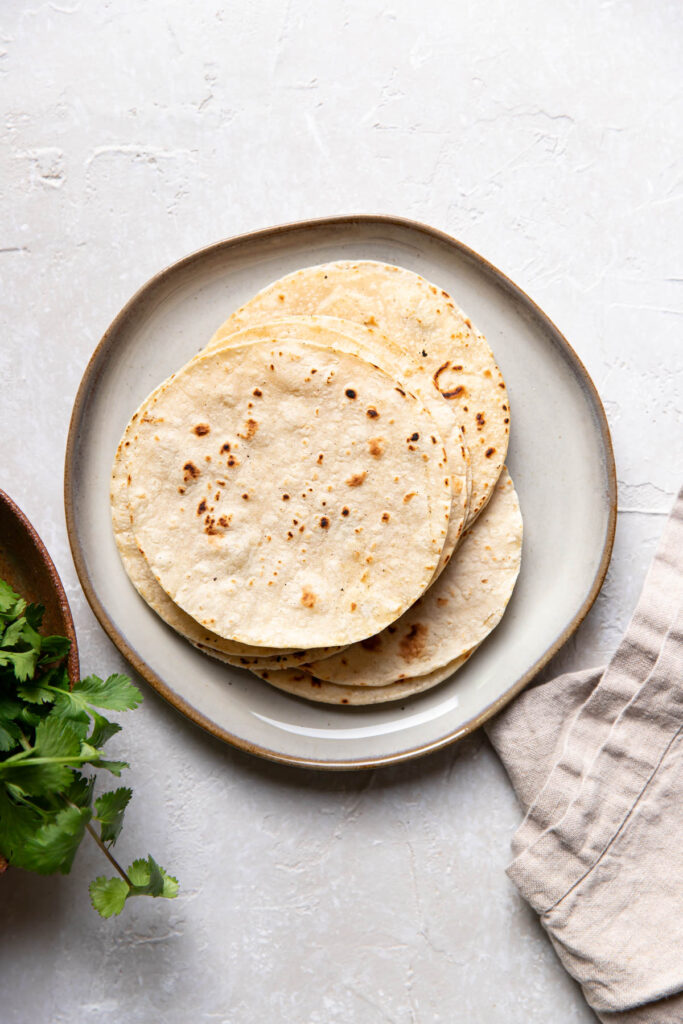 corn tortillas on a plate.