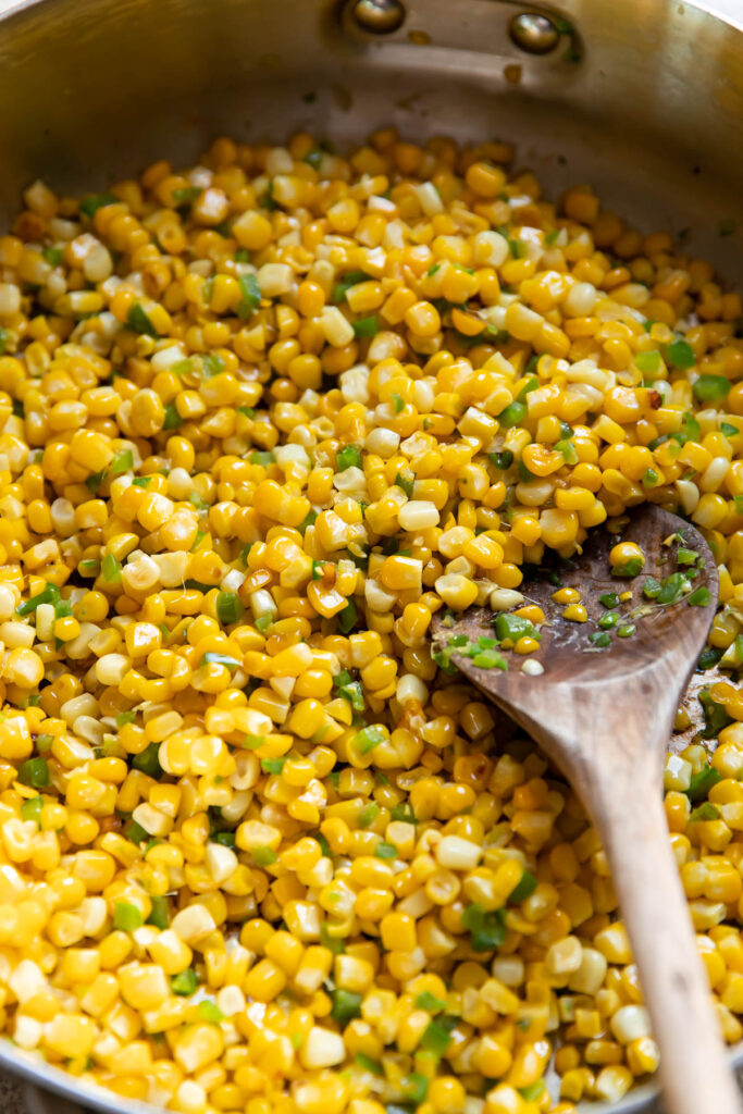 corn and jalapenos in a saute pan.