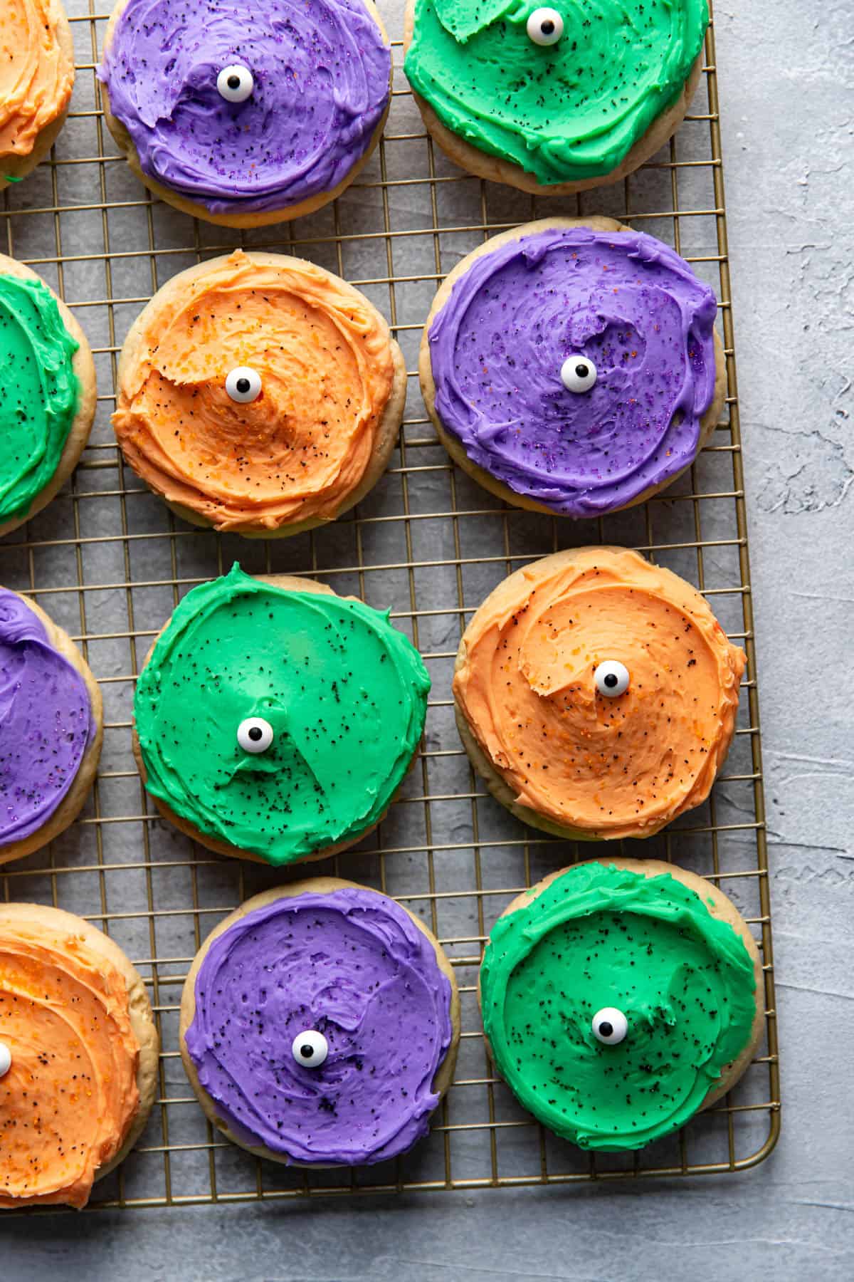 frosted sugar cookies decorated for halloween.