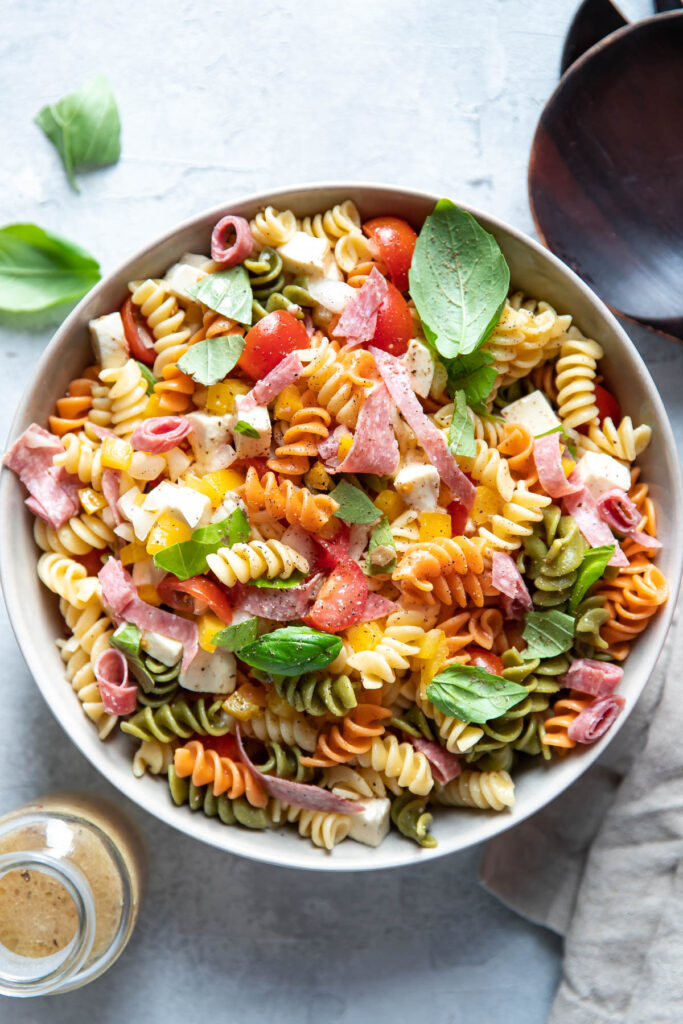 italian pasta salad with salami in a bowl.