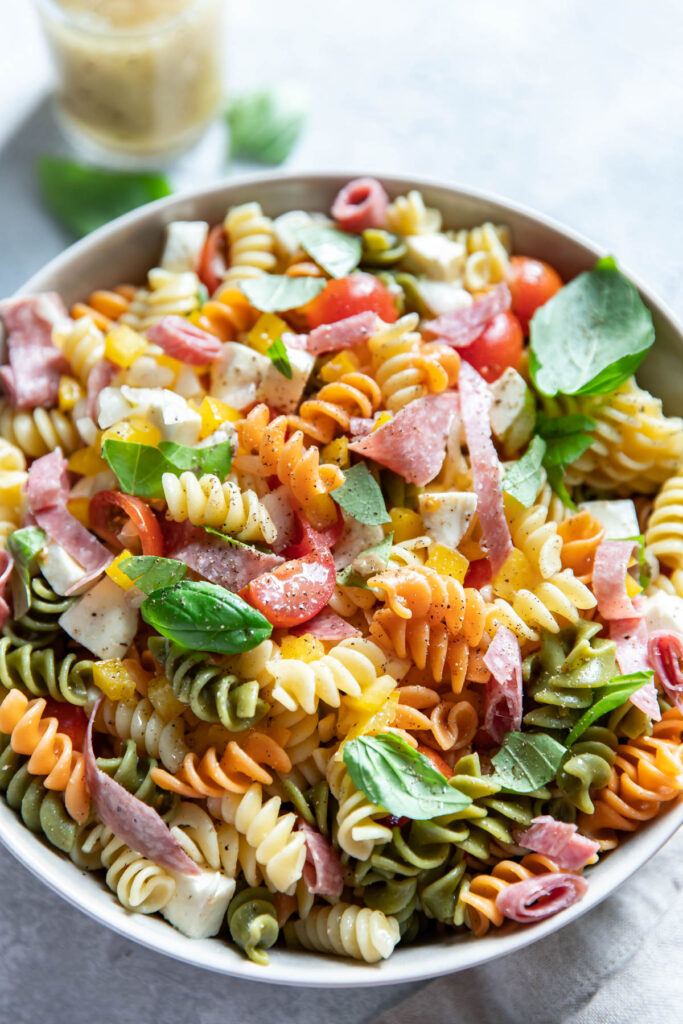 italian pasta salad with salami in a bowl.