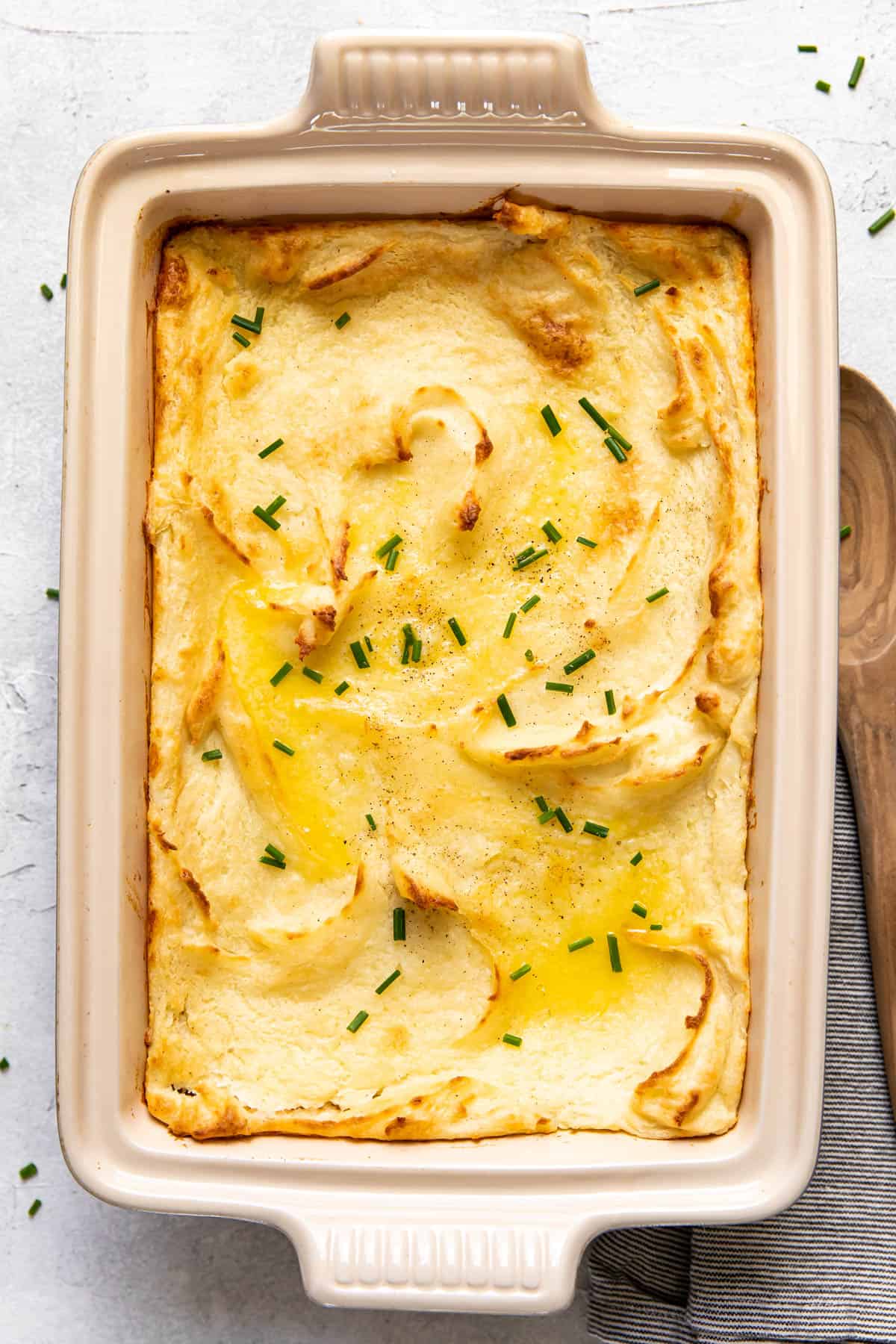 baked mashed potatoes in a baking dish.