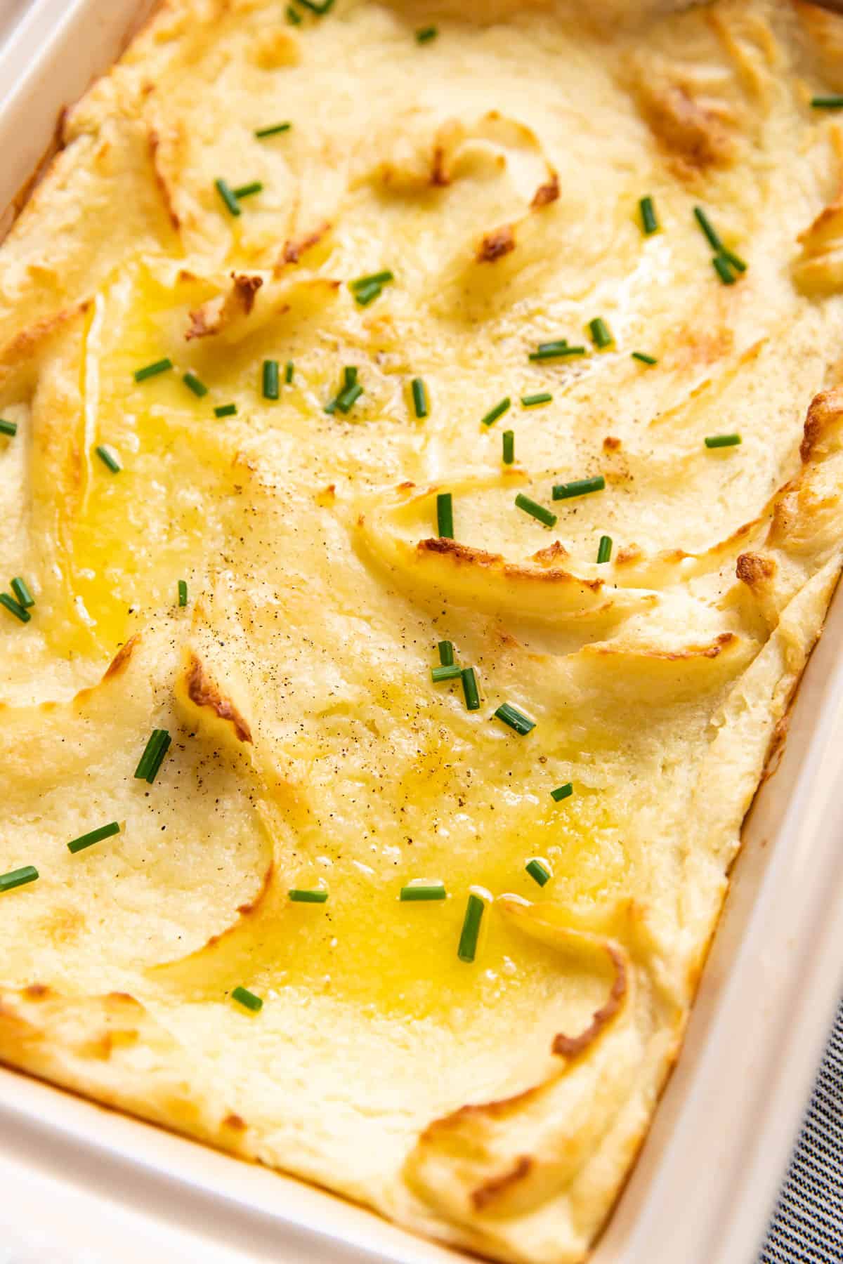 baked mashed potatoes in a baking dish.