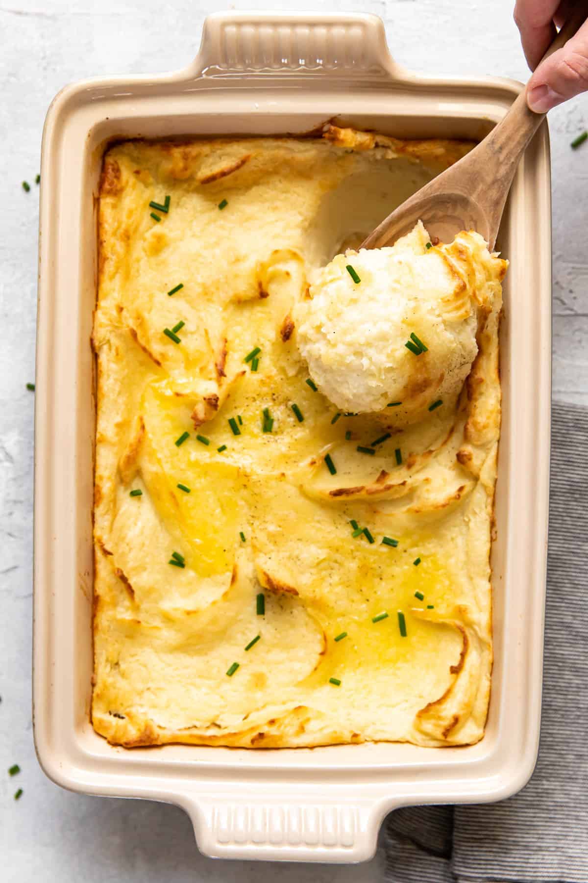 baked mashed potatoes in a baking dish.