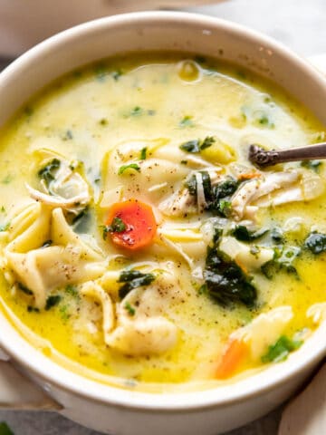 creamy chicken tortellini soup in a bowl.
