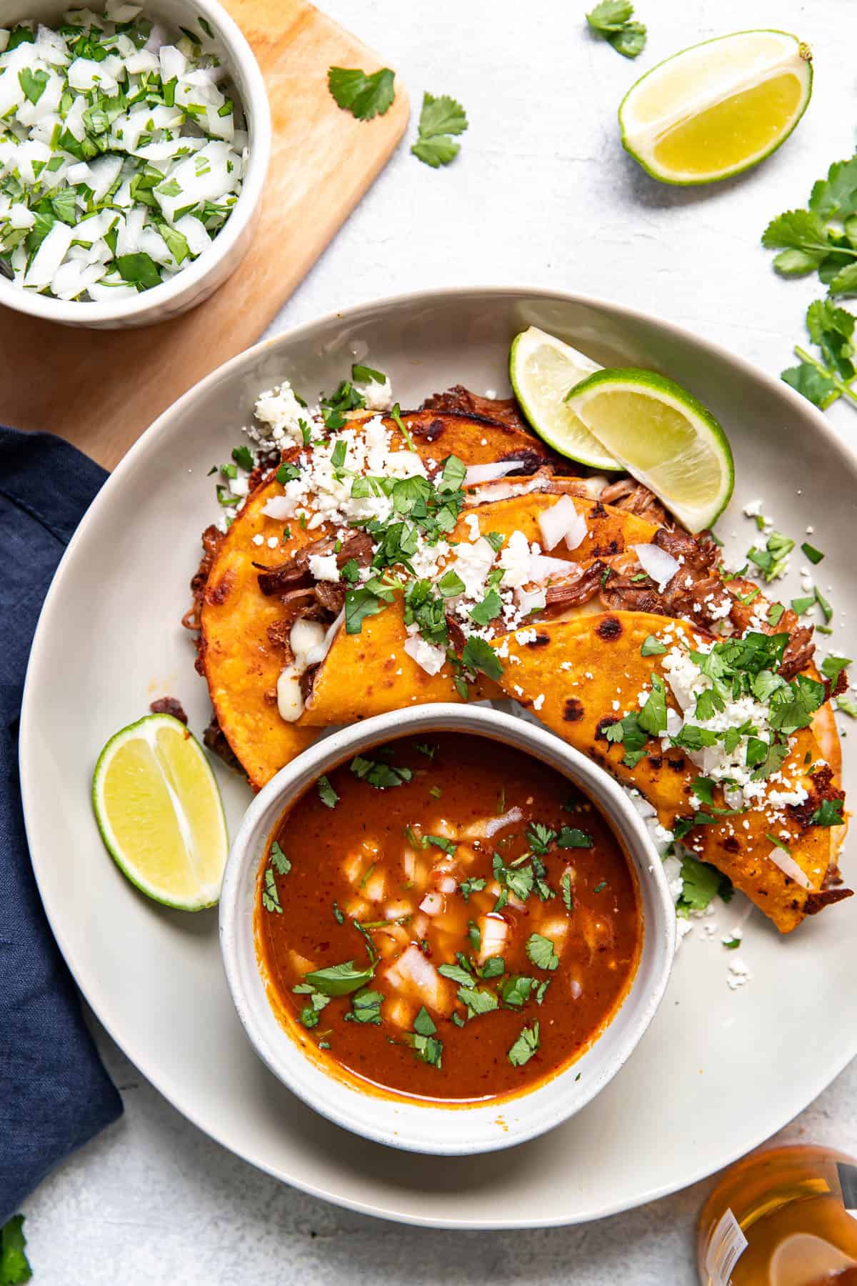 birria quesa tacos on a plate.