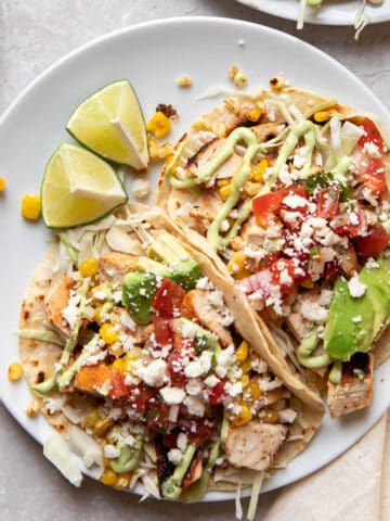 blackened chicken tacos on a plate.