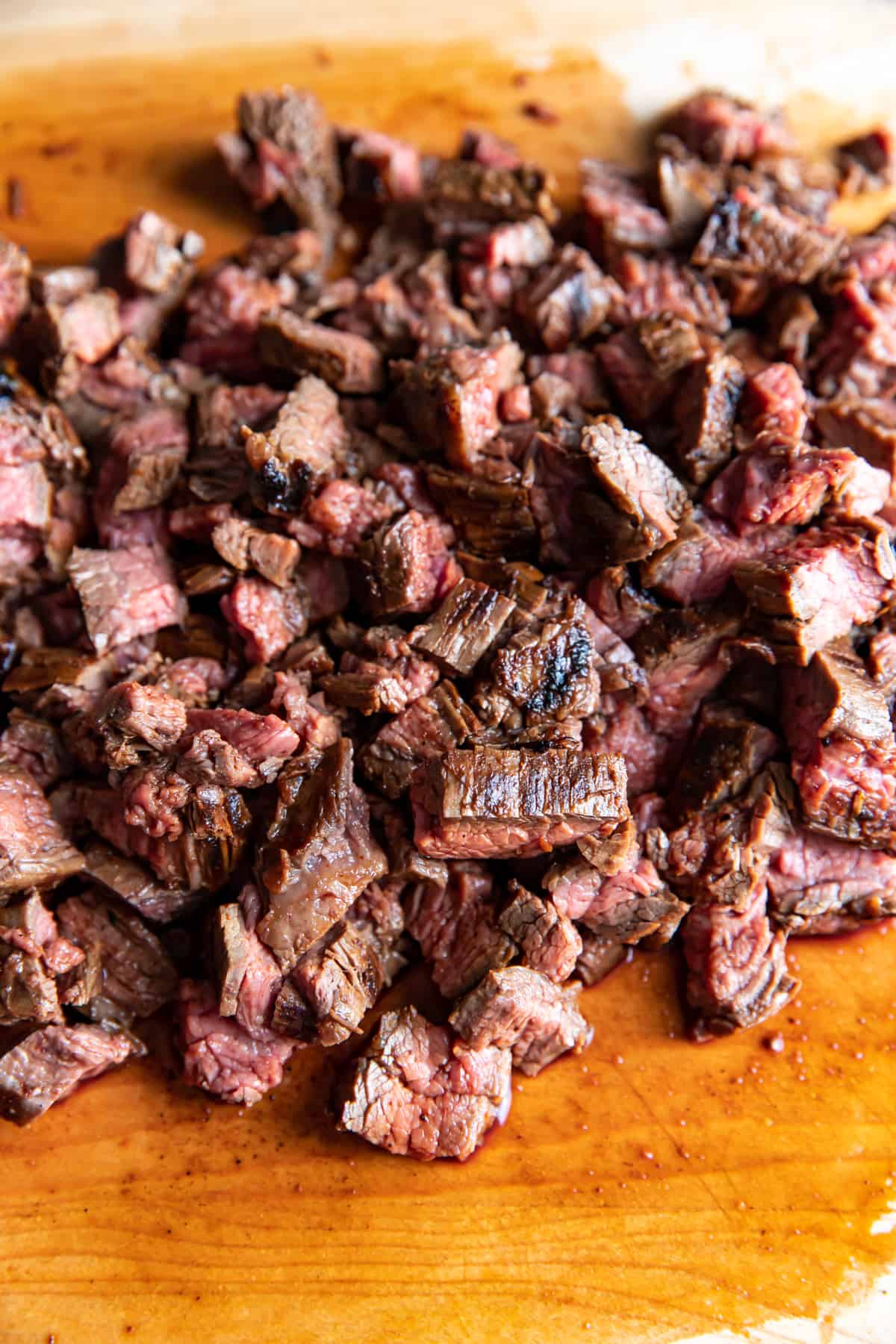 carne asada steak on a cutting board.