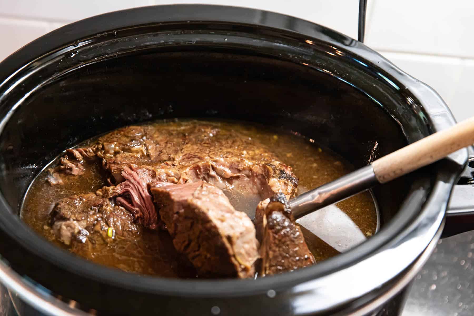 chuck roast in a slow cooker for pot roast.