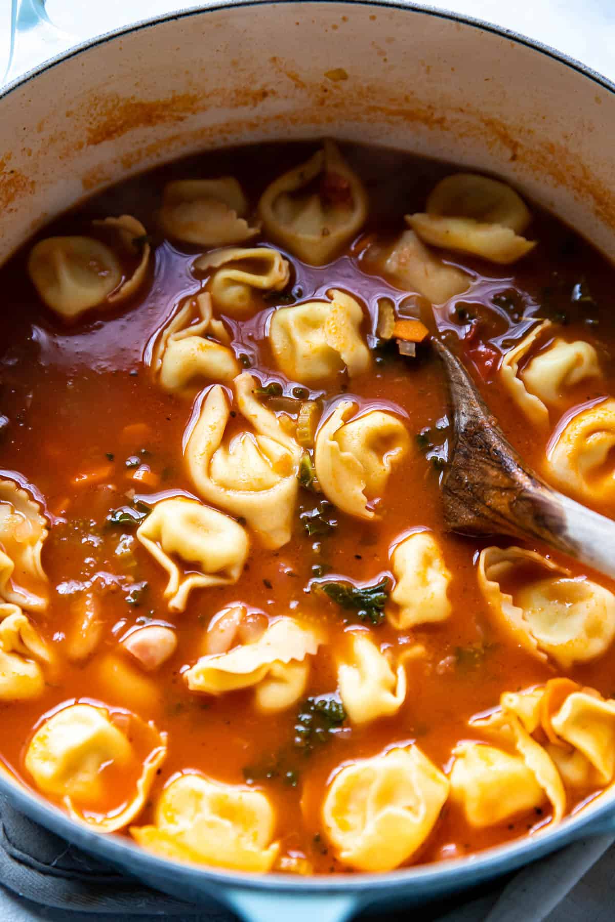 tuscan tortellini soup in a pot.