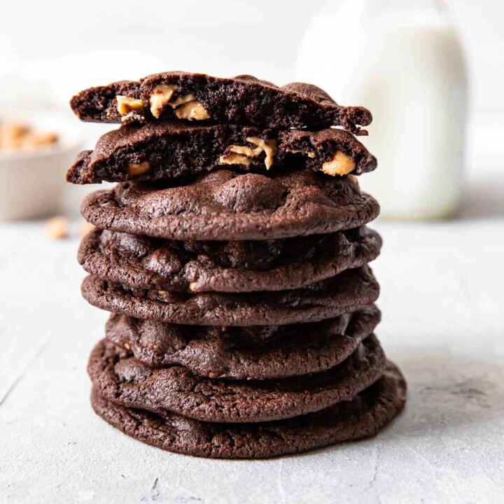 peanut butter chip chocolate cookies stacked on top of each other.