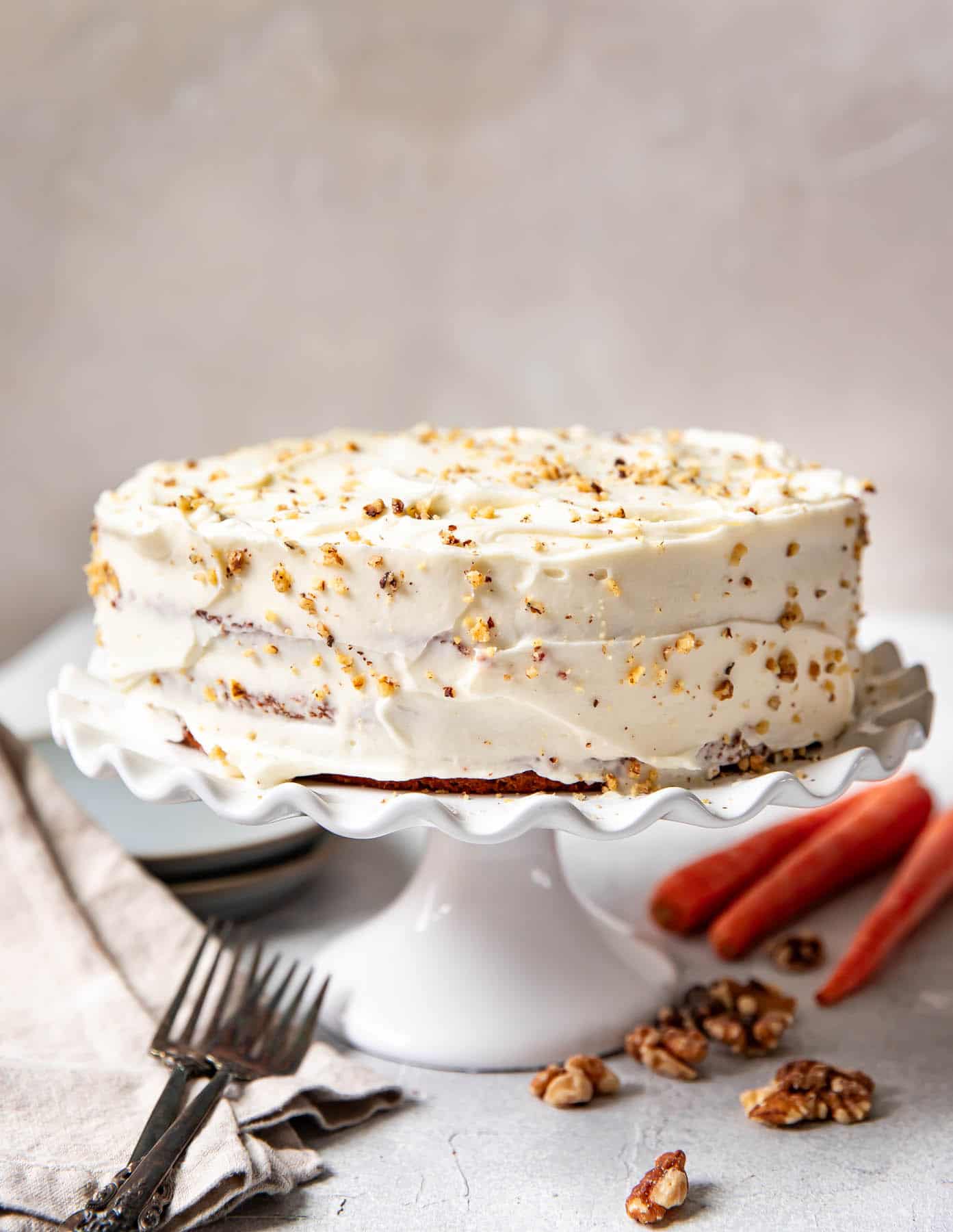 carrot cake on a cake stand.
