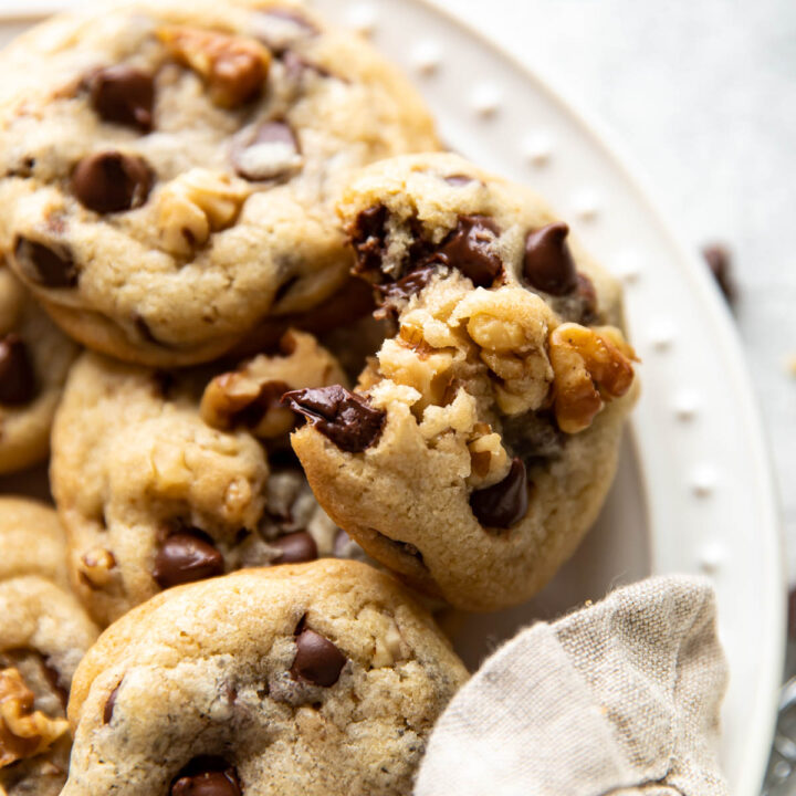 walnut chocolate chip cookies on a plate.