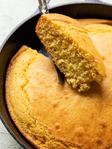 cornbread in a skillet after baking in the oven.