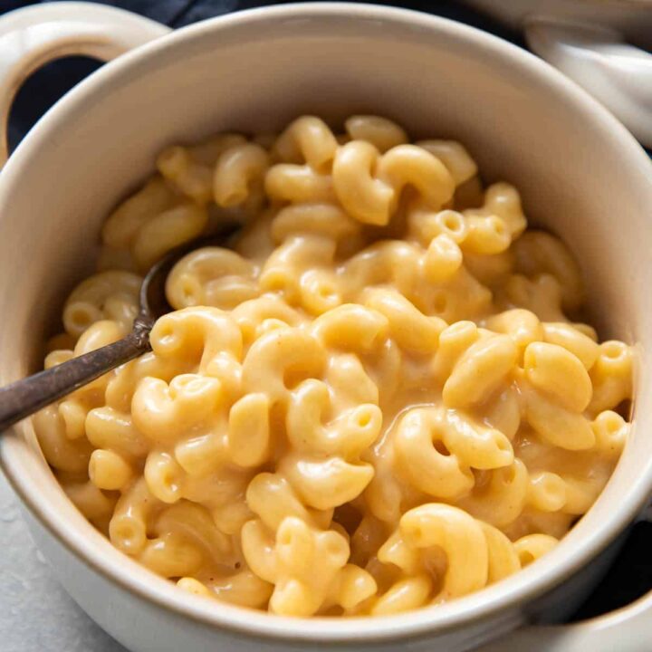 mac and cheese in a bowl with a spoon.