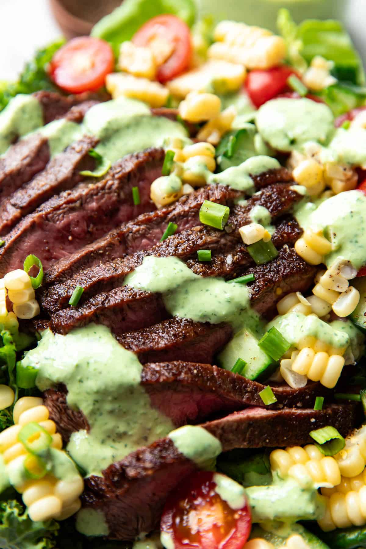 salad with steak and greed goddess dressing.